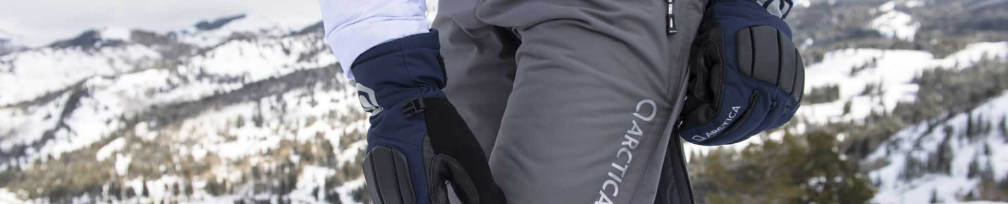 person adjusting race shorts on top of mountain