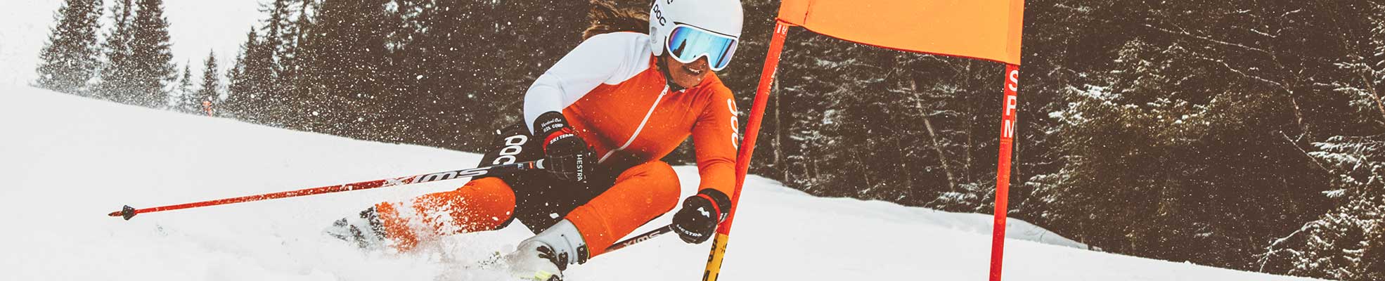 race skier going around flag turn