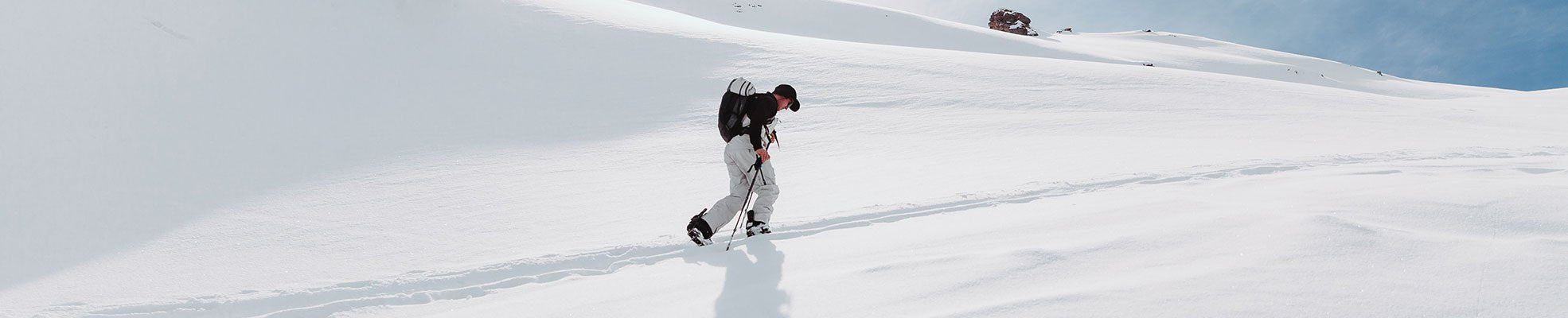guy hiking up the hill