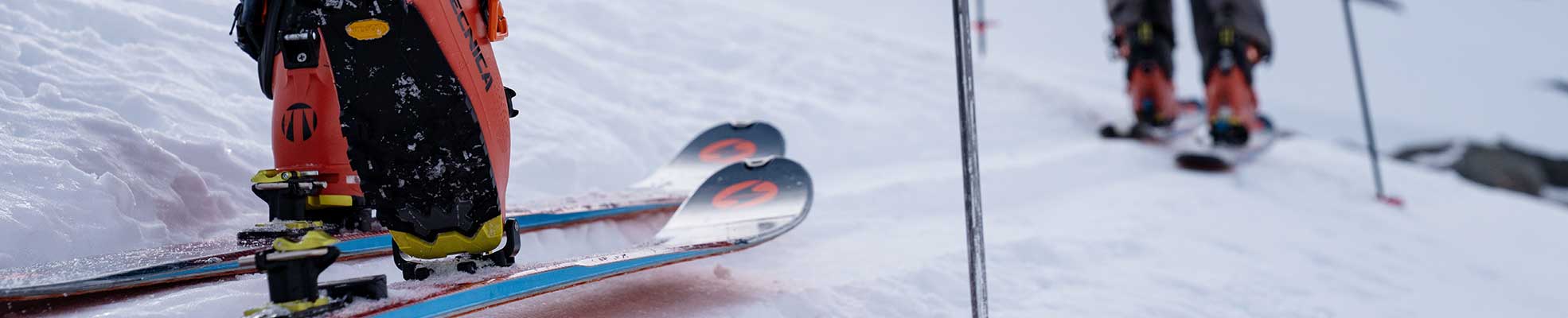 people wearing touring skis and ski boots