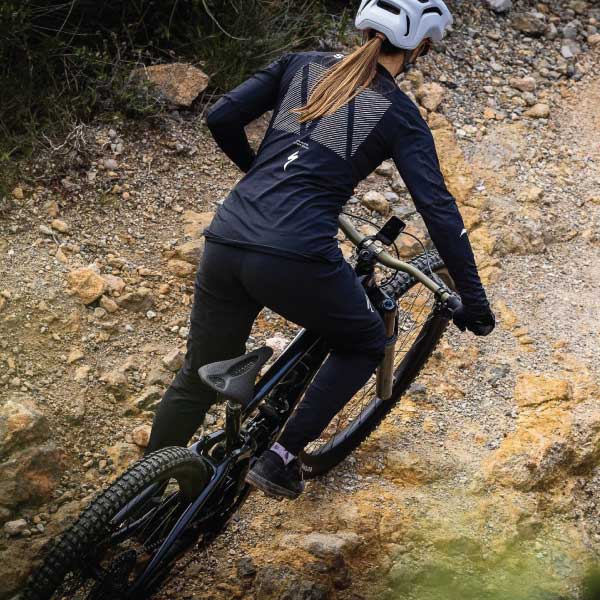woman cycling on a bike path