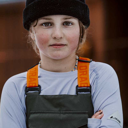 portrait of a young skier wearing a base layer top