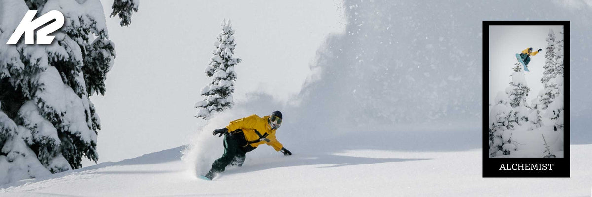 man snowboarding in deep powder