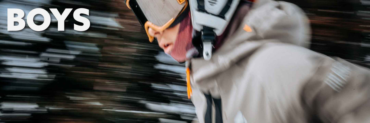 close up of boy skiing down a mountain