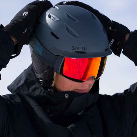 woman on the ski hill wearing goggles