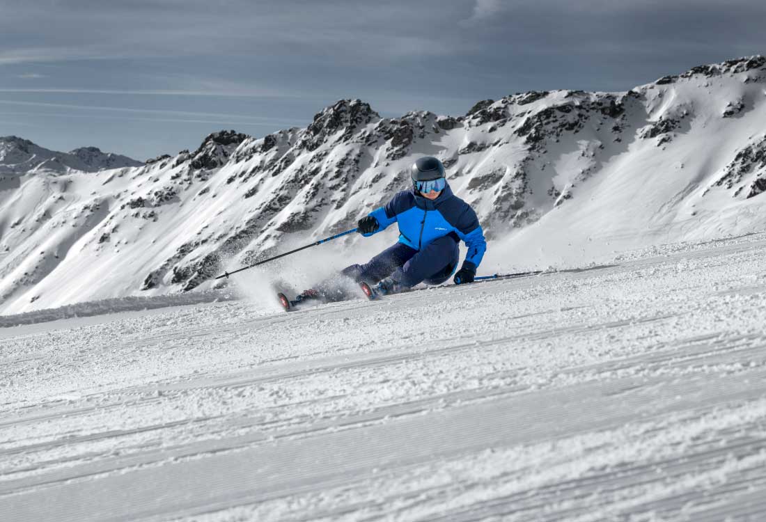 man skiing down a mountain