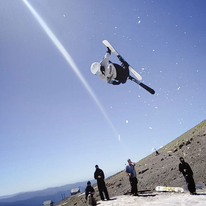 Skier mid-air doing a tail grab