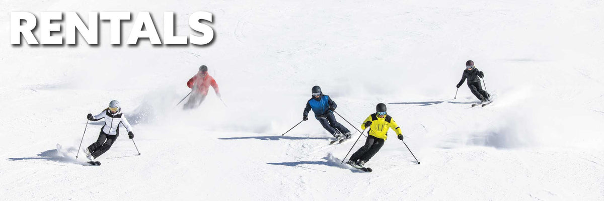 Skiers skiing down the hill